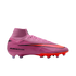 Profile view of a pink Nike Air Zoom Mercurial Superfly soccer cleat with orange accents and a high-top collar, shown on a black background.