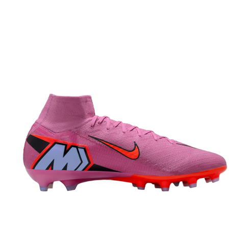 Pink Nike Mercurial soccer cleat with orange swoosh, large blue 'M' logo on the heel, and high-top collar, set against a black background.