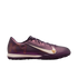 Side view of an iridescent purple Nike Mercurial turf soccer shoe featuring a large white Swoosh and gold "KM" branding on the heel.