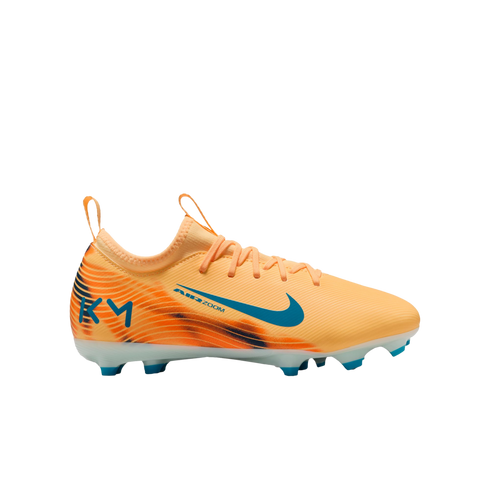 An orange Nike Air Zoom soccer cleat with teal accents and 'KM' logo, shown in profile against a black background.