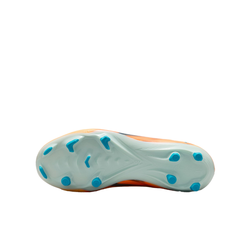 The underside of an orange Nike soccer cleat, featuring a light blue soleplate with bright blue studs against a black background.