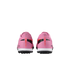 Rear view of a pair of pink Nike Mercurial soccer turf shoes against a solid black background.