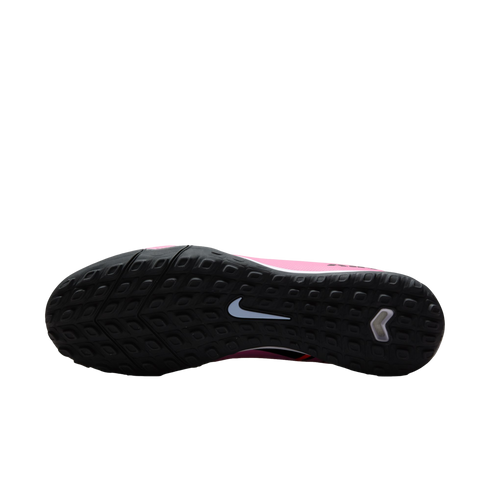 Underside of a Nike shoe featuring a black textured rubber sole with a central white swoosh and a pink upper.