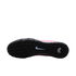 Underside of a Nike shoe featuring a black textured rubber sole with a central white swoosh and a pink upper.