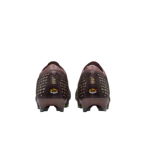 Rear view of two maroon soccer cleats with gold patterned details and a yellow "Zm Air" logo on each heel, set against a solid black background.