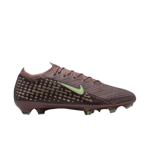 Profile view of a maroon Nike soccer cleat featuring a lime green swoosh and a gold textured pattern on the heel, set against a black background.