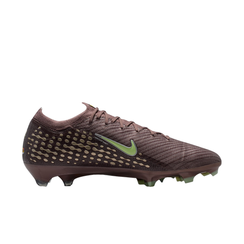 Side view of a maroon Nike soccer cleat with a lime green swoosh and gold patterned accents on the heel, set against a black background.