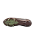 Sole of a bronze Nike soccer cleat with lime green studs and "AIR ZOOM KM" branding on a translucent forefoot plate, against a black background.