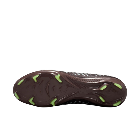 Sole of a dark brown soccer cleat with neon green studs, shown against a black background.
