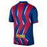 Back view of a blue soccer jersey with red and light blue zig-zag patterns. A yellow UNHCR ACNUR logo is printed at the bottom.