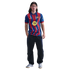 A young man with long hair wearing a red and blue zig-zag FC Barcelona jersey, dark track pants, and silver sneakers against a black background.