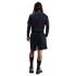 A back view of a person wearing a navy and red pinstriped jersey, black shorts, and black and red sneakers against a white background.