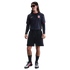 A person with long hair in sunglasses wearing a black pinstriped USA soccer jersey, black shorts, and Nike sneakers against a white background.