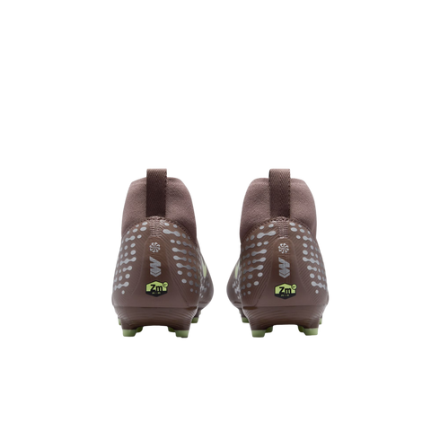 Rear view of two brown Nike Mercurial soccer cleats with silver dot patterns, "Zm Air" logos on the heels, and lime green studs against a black background.