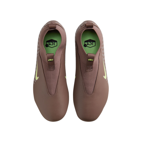Top-down view of mauve Nike Kylian Mbappé soccer cleats with lime green accents and insoles, set against a solid black background.