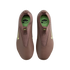 Top-down view of mauve Nike Kylian Mbappé soccer cleats with lime green accents and insoles, set against a solid black background.