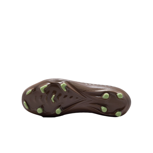 Underside of a brown soccer cleat showing lime green studs against a black background.