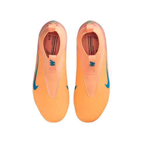 Top-down view of bright orange Nike Kylian Mbappé soccer cleats with blue swooshes on a black background.