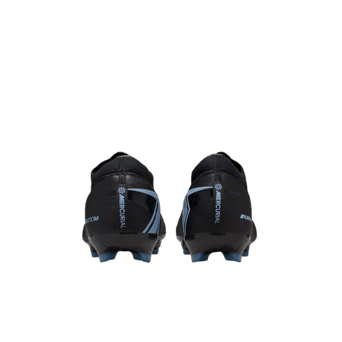 Rear view of black Nike Mercurial soccer cleats with light blue accents, isolated on a black background.