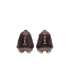 Rear view of two burgundy Nike soccer cleats with silver patterns and lime green accents against a black background.