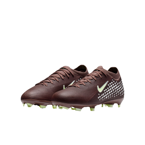 A pair of maroon Nike soccer cleats with white dots on the heel, a pale green swoosh, and matching studs, displayed against a black background.