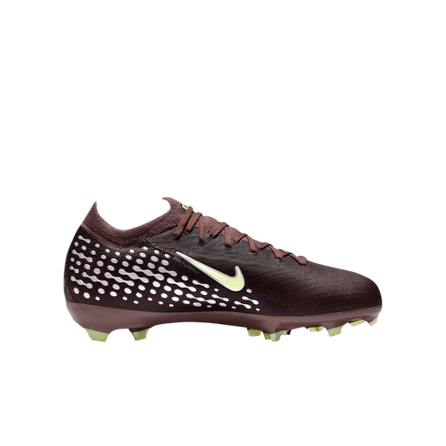 Profile of a burgundy Nike soccer cleat with light yellow accents and white patterned dots, set against a solid black background.
