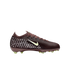 Profile of a burgundy Nike soccer cleat with light yellow accents and white patterned dots, set against a solid black background.