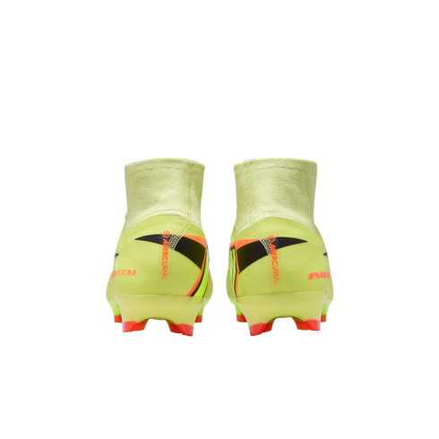 Rear view of neon green Nike Mercurial soccer cleats with orange and black accents, featuring high-top sock collars, against a solid black background.