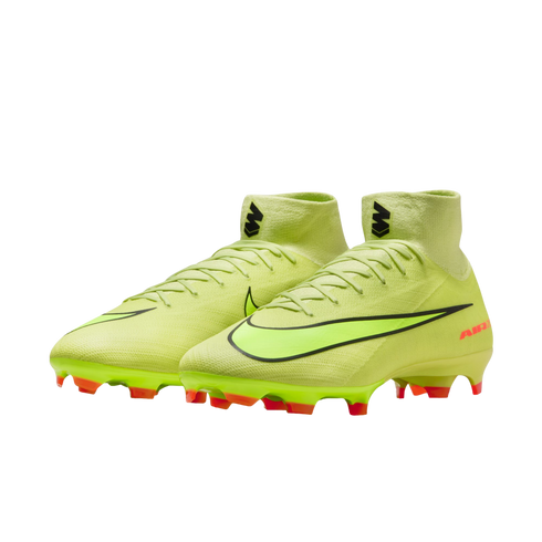 Neon green Nike soccer cleats with high-top ankle collars and bright orange studs, shown against a solid black background.