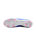 Underside of a Nike soccer cleat featuring a white soleplate with pink chevron-shaped studs, set against a solid black background.