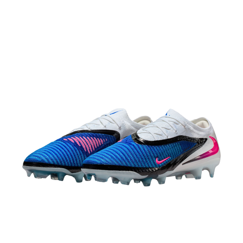 A pair of blue, white, and black Nike Phantom GX soccer cleats with pink accents on a black background.