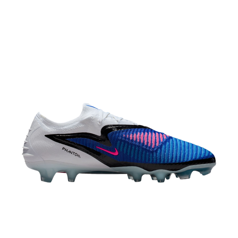 Side profile of a Nike Phantom football boot with a white heel and blue textured forefoot with pink accents, set against a black background.