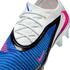 Close-up of a Nike Phantom GX soccer boot featuring a white knit collar, textured blue upper, and a pink swoosh.