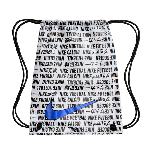 White Nike drawstring bag with black repeating text in multiple languages and a large blue swoosh, against a black background.