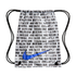 White Nike drawstring bag with black repeating text in multiple languages and a large blue swoosh, against a black background.