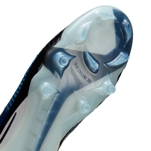 Close-up of the bottom of a Nike soccer cleat with a translucent sole, blue and white studs, and "NIKE CYCLONE 360" text.