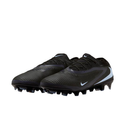 A pair of black Nike soccer cleats with light blue accents and textured uppers, set against a solid black background.