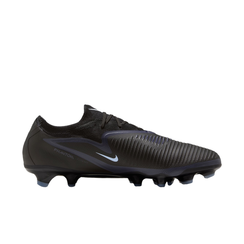 Profile of a black Nike Phantom football boot with light blue accents, a textured upper, and blue-tipped cleats, set against a black background.