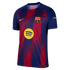 FC Barcelona home jersey with blue and red vertical stripes, yellow Nike swoosh, club crest, and a yellow Spotify logo in the center.