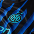 Close-up of a blue and black striped soccer jersey featuring the cyan Inter Milan crest and two stars above it.