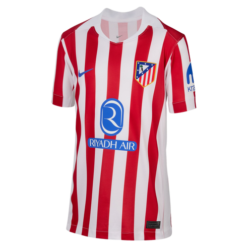 Atlético de Madrid home soccer jersey with red and white vertical stripes, featuring the club crest, Nike swoosh, and Riyadh Air sponsor logo on the front.
