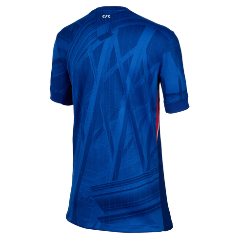 Back view of a blue soccer jersey featuring an abstract tonal graphic pattern, "CFC" on the back neck, and a red and white side stripe.
