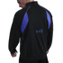 Rear view of a man wearing a black and purple sports jacket with FC Barcelona and Kobe Bryant logos on the lower back.