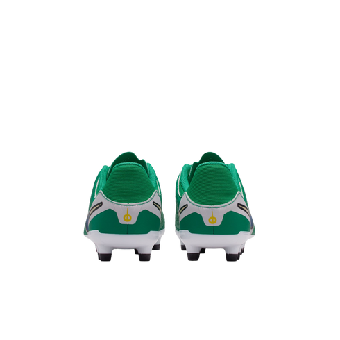 Rear view of a pair of green and white soccer cleats with black studs and small yellow logos on the heels, set against a plain white background.