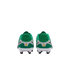 Rear view of a pair of green and white soccer cleats with black studs and small yellow logos on the heels, set against a plain white background.