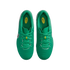A top-down view of a pair of bright green Nike soccer cleats with matching laces and yellow brand logos on the tongue and insoles.
