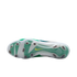Outsole of a white and green Nike soccer cleat featuring translucent studs and a small yellow swoosh on a white background.