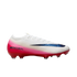 Side-profile of a white Nike Mercurial soccer cleat with a pink gradient, metallic blue swoosh, and red sole with studs, isolated on white.