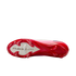 The soleplate of a pink and red Nike Mercurial soccer cleat with "AIR ZOOM" branding and red studs.