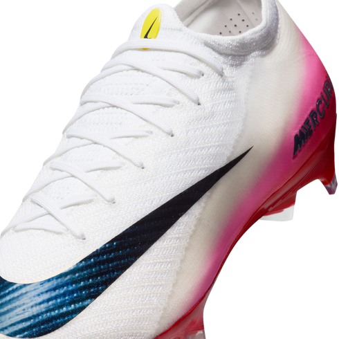 Close-up of a white Nike Mercurial soccer cleat featuring a pink gradient on the heel and a large black swoosh with a blue textured pattern.